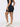 High rise pocket shorts in Black - side view showing the slim fitted silhouette.