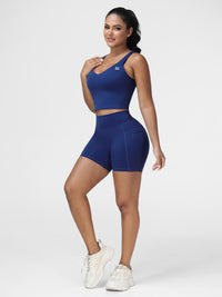 Longline sports bra and high rise gym shorts set in Navy Blue - front view, matching activewear set.