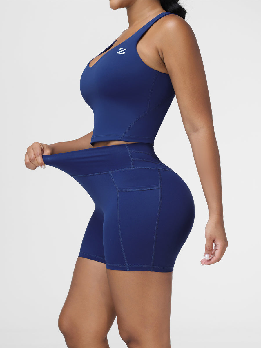 High rise gym shorts in Navy Blue - side view showing the seamless high waisted fit.