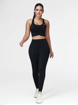 Women's running set in Black - front view showing the twisted front bra and the pocket leggings.