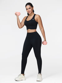 Women's running set in Black - front view showing the ruched sports bra and high waist pocket leggings, two-piece set.