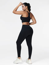 Running set for women in Black - three quarter view showing the racerback bra and the high waistband leggings.