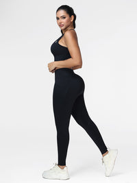 Running set for women in Black - side view showing the racerback bra and the slim leg leggings.