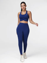 Women's running set in Navy Blue - front view showing the twisted front bra and the high waist leggings.