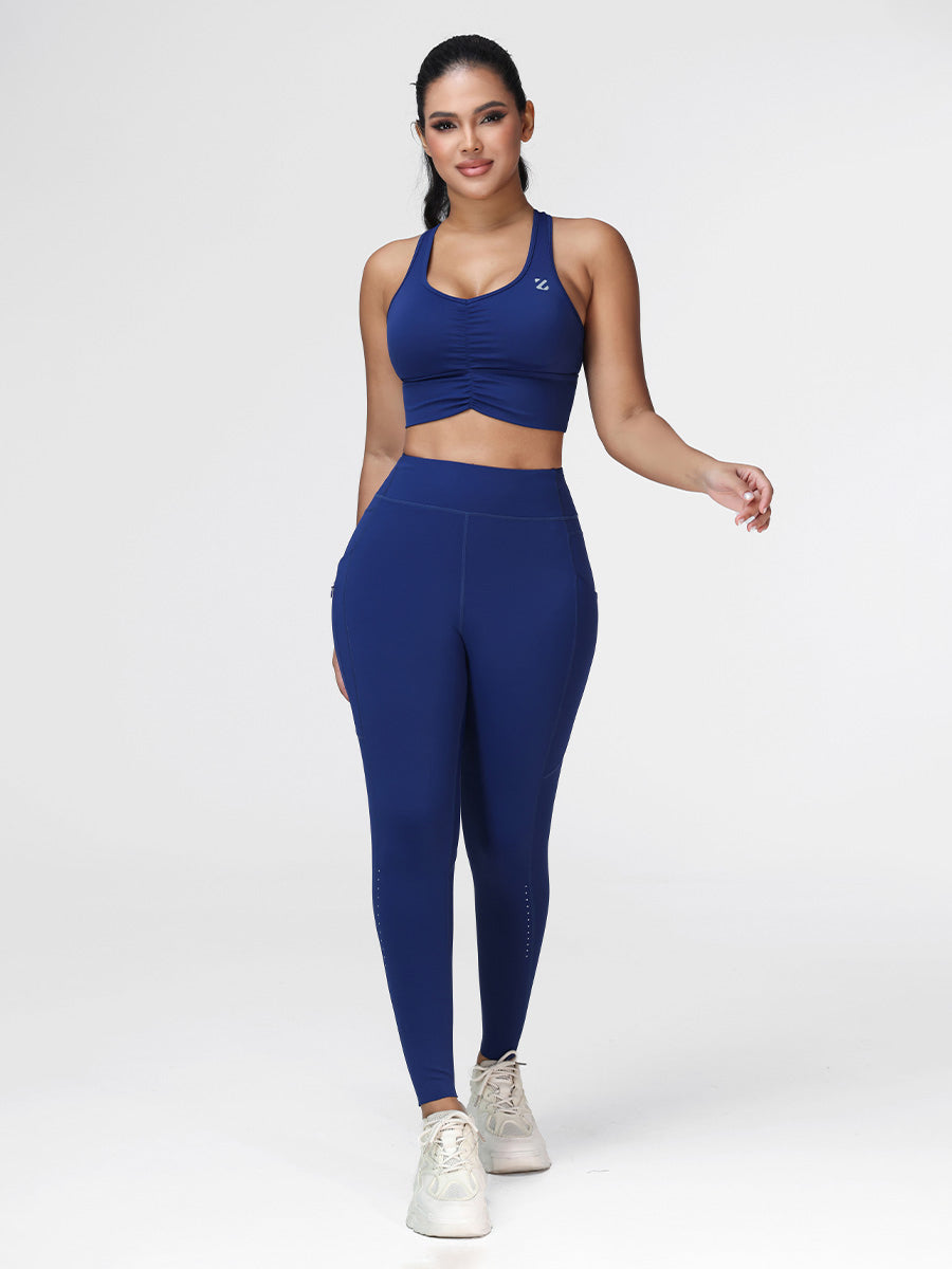 Women's running set in Navy Blue - front view showing the twisted front bra and the high waist leggings.