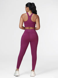 Running set for women in Deep Purple - back view showing the racerback sports bra and the high waistband.