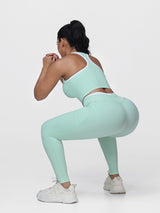 Women's 2 Piece Workout Set Racerback Sports Bra and Cross Waist Pocket Leggings